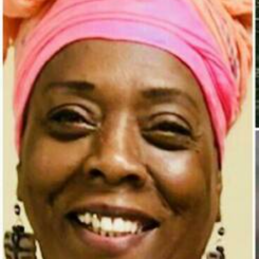 Photo of Tovah Reuven, an African American woman, smiling, with her hair wrapped in a pink and orange headwrap